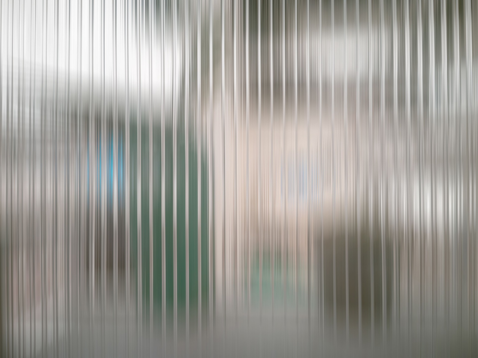 Gray frosted glass and shadow from behind. Vertical lines glass pattern