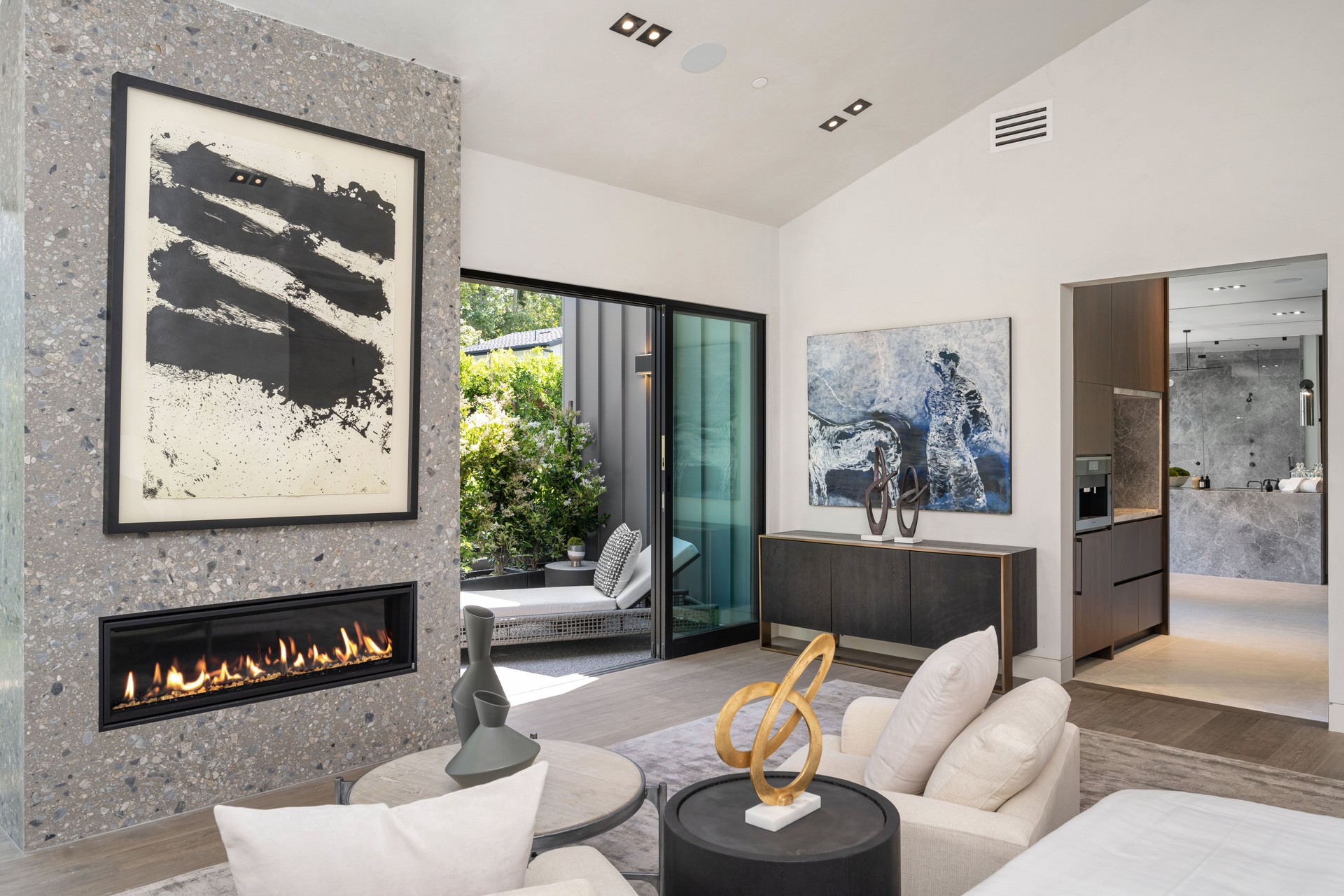 Modern living room with fireplace and abstract art