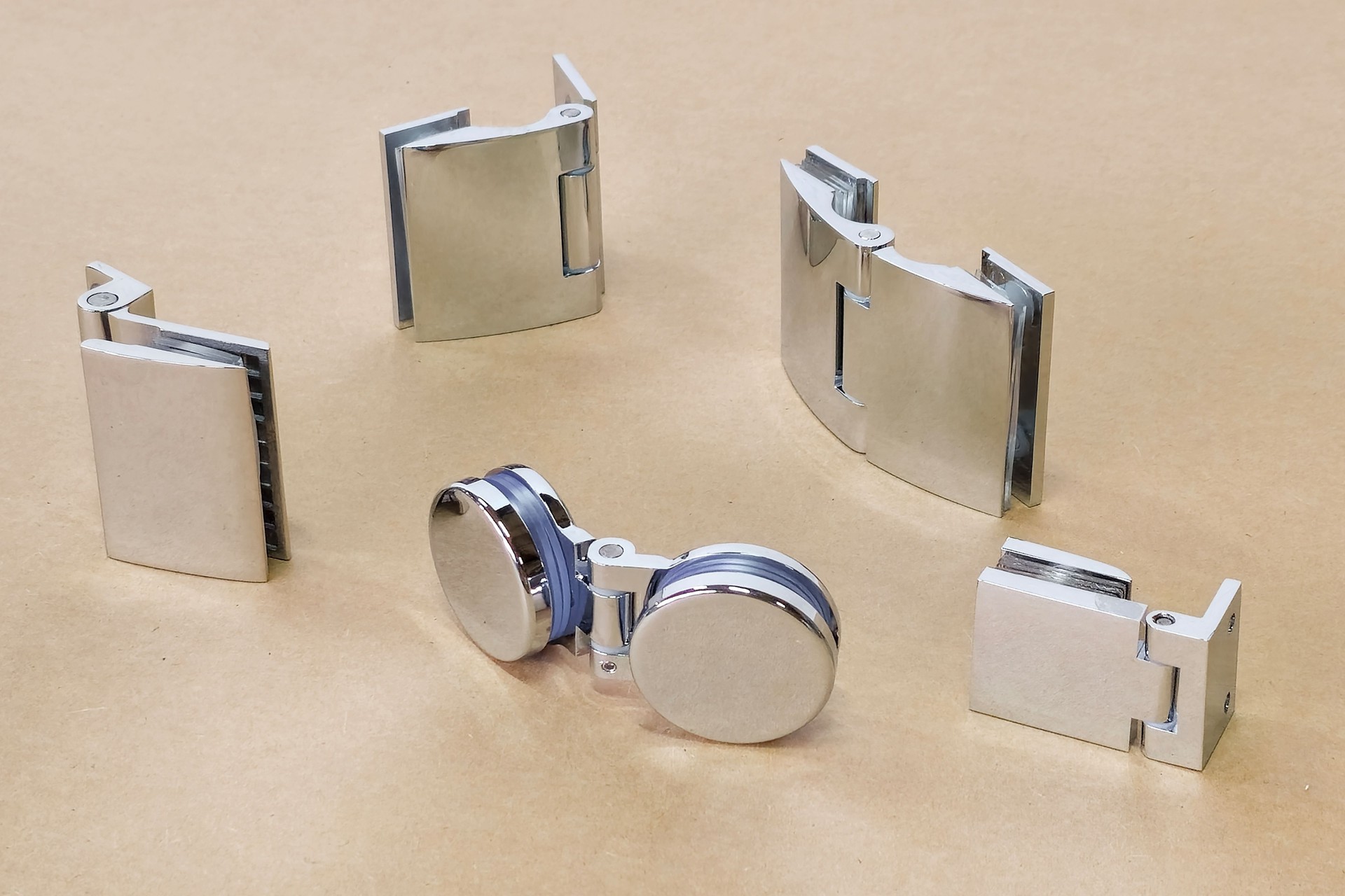 variety of chrome glass hinges are laid